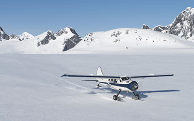 Plane landing on snowy mountain