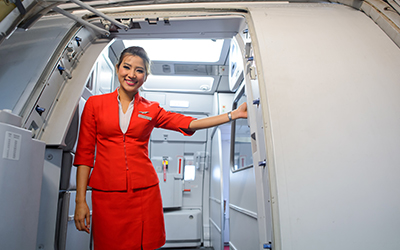 Flight attendant smiling
